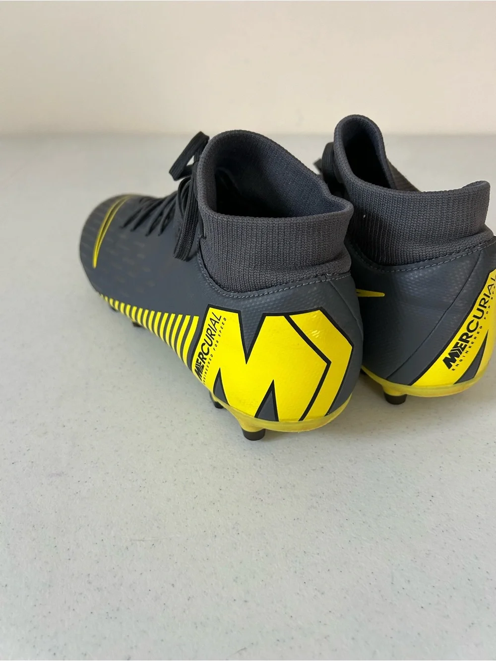 Nike Men’s Black Soccer Cleats with Yellow Swoosh